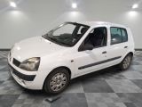 a picture of a small white car parked on a checkered floor