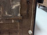 a close up of a wooden door with a latch