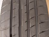 a close up of a car tire on a wooden surface