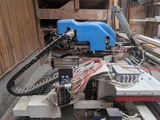 a picture of a machine that is working on a piece of wood