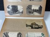 an old photo of an open book with pictures of a train station