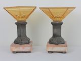 two vases that are sitting on top of each other