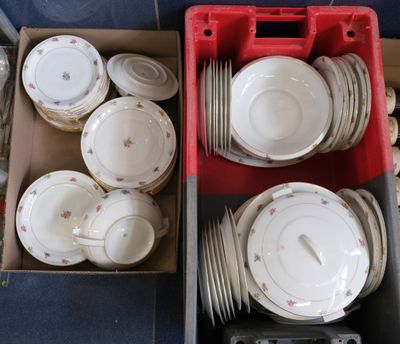 a lot of plates and bowls in a red box