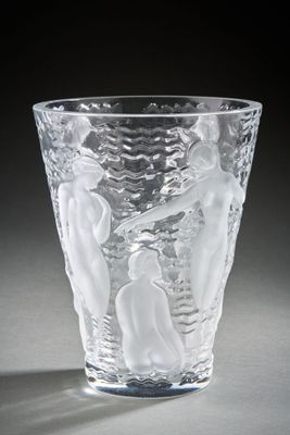 a glass cup that has a picture of a man and a woman on it