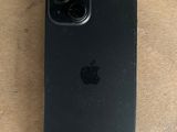 an iphone 11 is sitting on a wooden surface