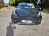 a black car parked on the side of the road