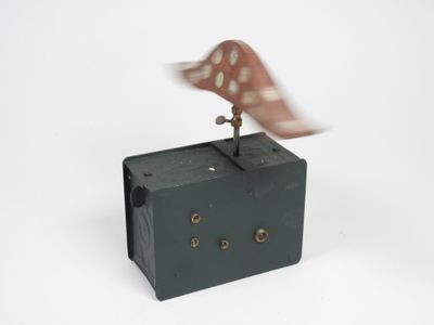 a bird that is sitting on top of a clock