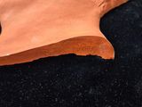 an image of a clay sculpture of a man ' s head