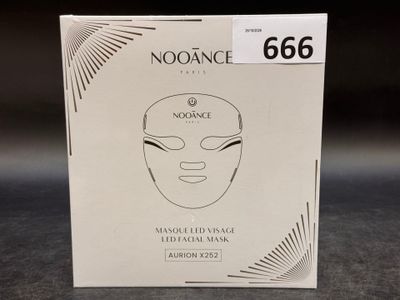 a box with a face mask on it sitting on a table