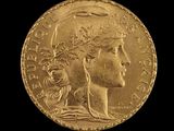 an image of a gold coin with a woman ' s head on it