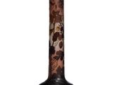 a vase with a floral design on it sitting on a table