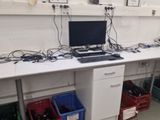 a desk with a laptop on it in a room