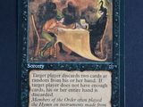 a close up of a card with a picture of a person sitting at a table