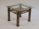 a glass table with a metal frame and a glass top