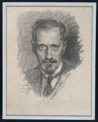 portrait d'un homme en costume-cravate, dans un cadre noir