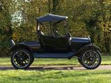 a black antique car parked on the side of the road
