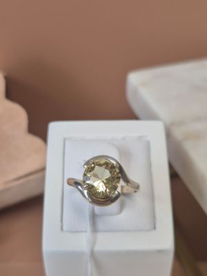 a ring that is sitting in a box on a table