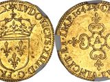 a gold coin with a crown on top of it
