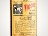 an image of a bottle of white horse vodka on a gray background