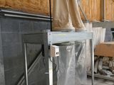 an image of a room with a table and a chair