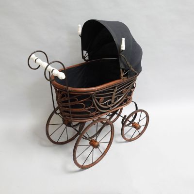 a baby stroller with a black cover on it