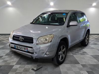 a picture of a silver toyota rav parked in a garage