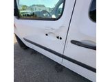 a white van with holes in the side of it