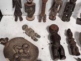 a lot of wooden figurines that are on the table