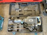 a tool in a case that is sitting on the floor