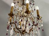 an image of a chandelier hanging from the ceiling in a room