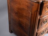 a wooden chest of drawers on a white background