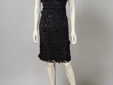 a black lace dress with short sleeves and a short skirt