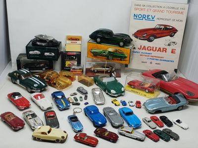 a lot of toy cars that are sitting on a table