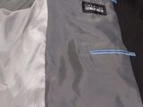 a jacket that is open on a white surface