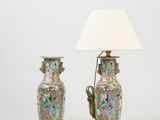 pair of chinese famille vases with lamps on stands