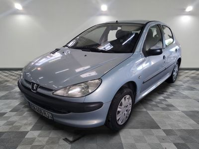 a silver car that is sitting on a checkered floor