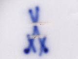 a plate with a blue and white design on it