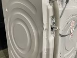 an image of a white washing machine in a room