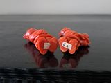 two pieces of carrots sitting on a black table