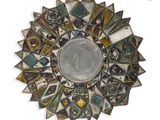 a picture of a decorative mirror on the wall