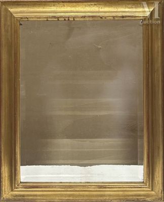 an antique gold framed mirror with a white background