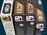 boxes of lego star wars minifigurts are stacked on top of each other