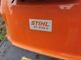 a close up of a sticker on the back of an orange vehicle