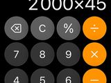 an image of a calculator on a cell phone with a black background
