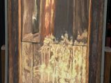 a picture of a painting on a table in front of a red wall