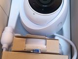 a camera that is sitting in a box next to a charger