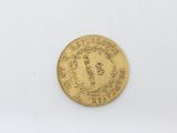 a gold coin with the head of a woman on it
