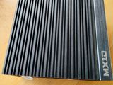 a close up of a metal fan on a wooden table