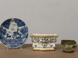 three bowls and a bowl sitting on a table