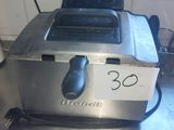 a toaster that is sitting on a counter in a kitchen
